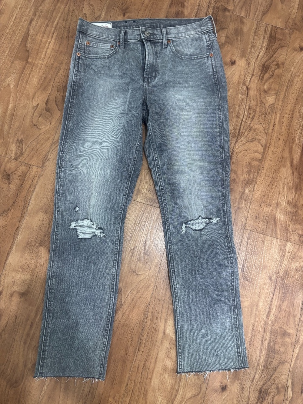Gap Vintage Slim Mid Rise jeans in a grey wash featuring a classic five-pocket